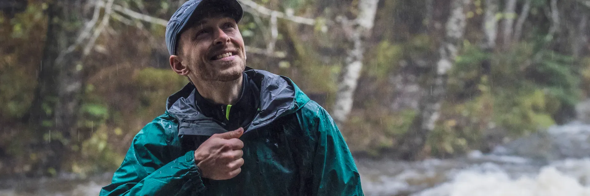 nikwax-man-wearing-waterproof-jacket-in-rain-1920px Nikwax Man Wearing Waterproof Jacket In Rain 1920px